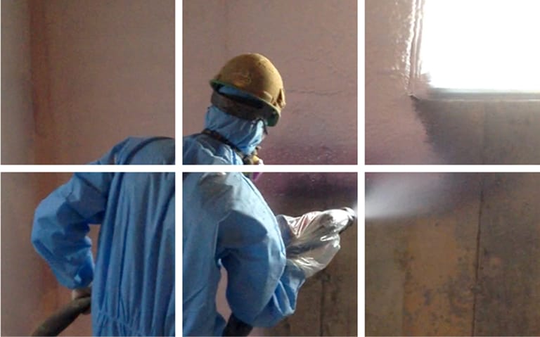 Application d'urethane giclee sur les murs d'un sous-sol.